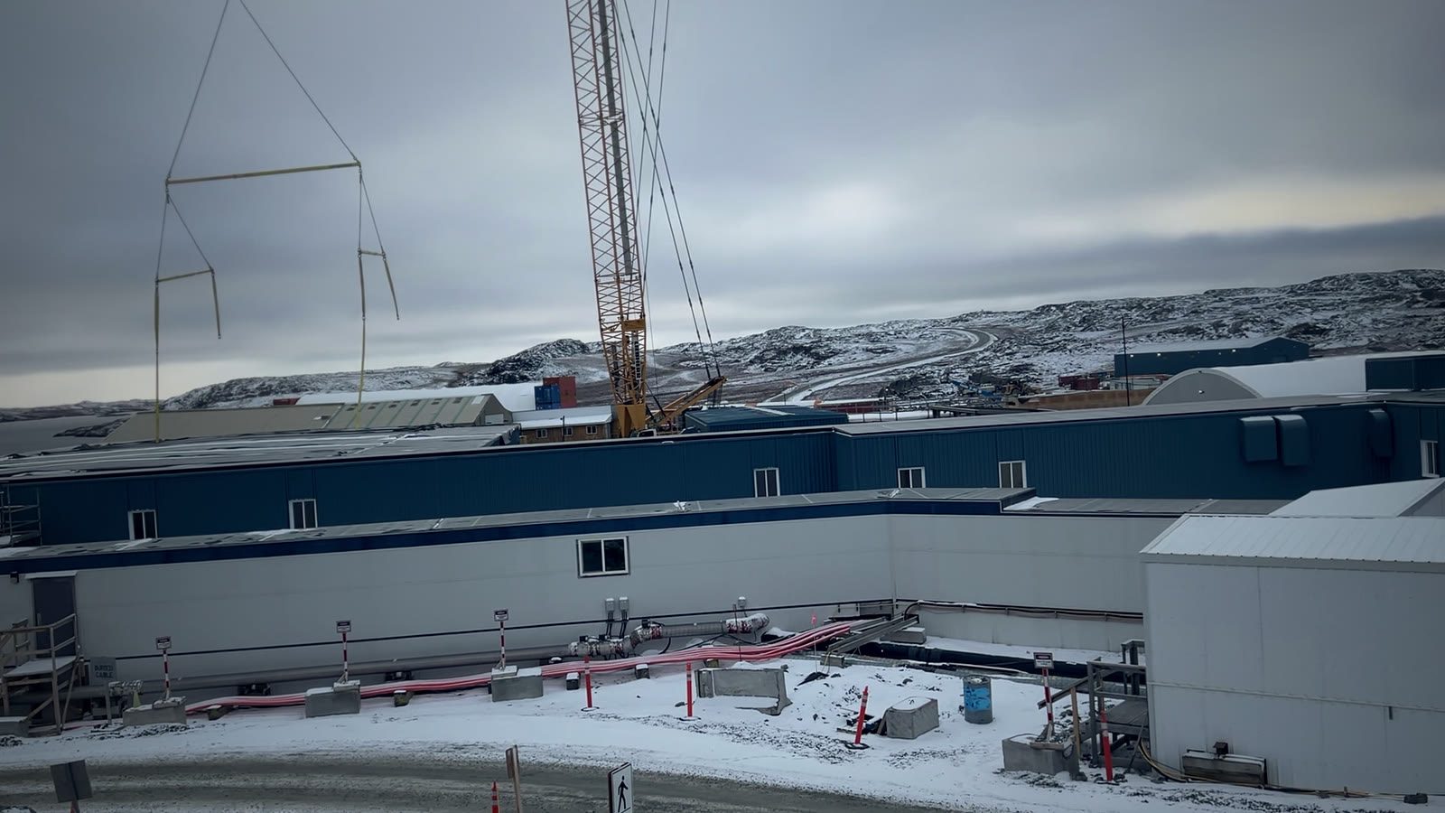 Remote northern mine site under early snow